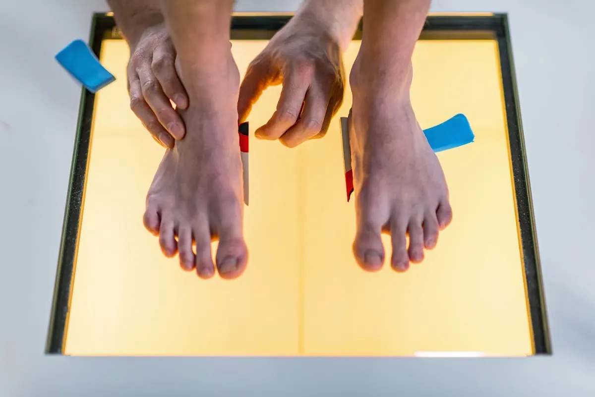 Foot being scanned for custom toe separators and orthotics