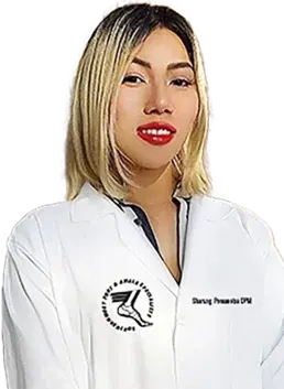 Female podiatrist in white coat smiling confidently.