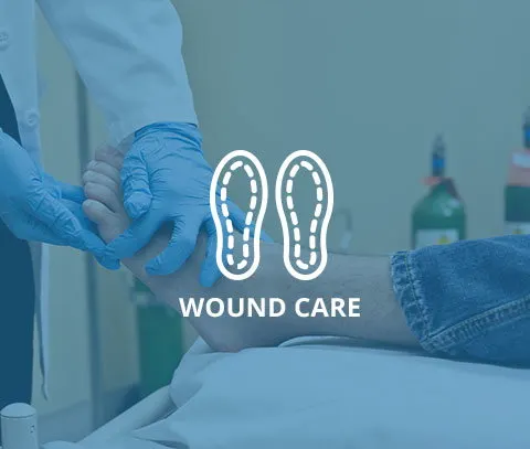 Medical professional providing wound care to a patient's foot.